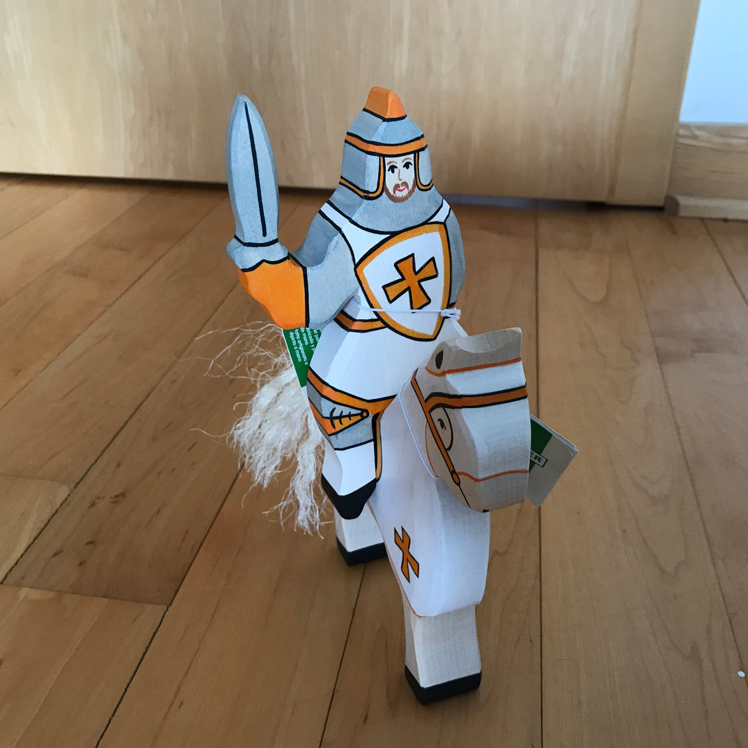 Holztiger white knight riding atop horse